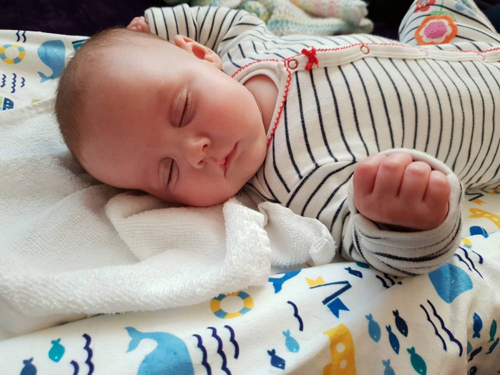 a baby on a maasage mat