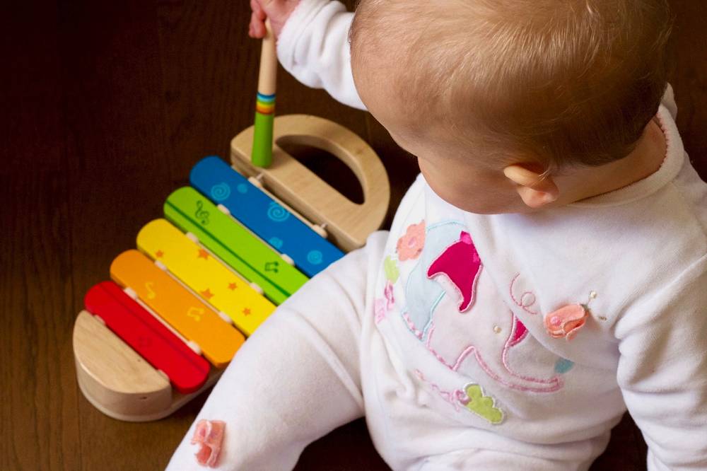 a tiny stomper playing a xylophone